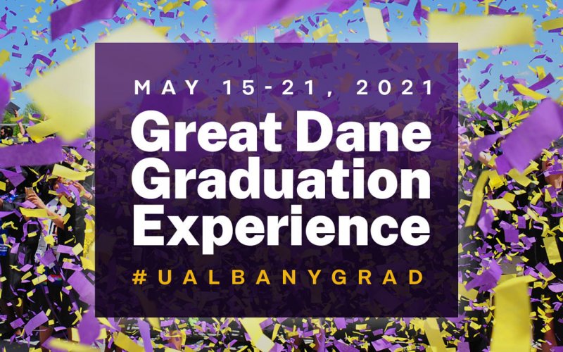 A purple sign with white letters says Great Dane Graduation Experience