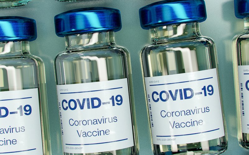 Vials of COVID-19 vaccine, in a row