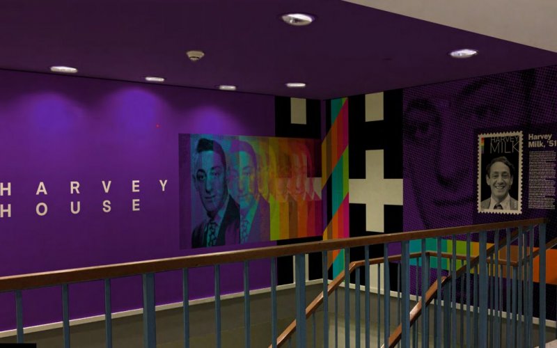 A purple wall in a staricase is printed with the words Harvey House and shows repeating colorful images of Harvey Milk