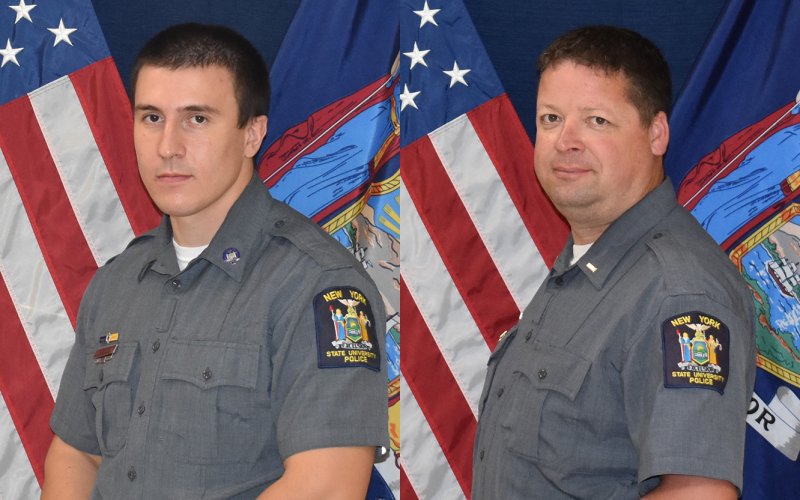 Two UAlbany Police office pose in uniform