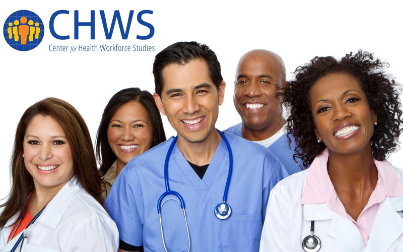 A group of doctors smile at the camera. Behind them is the Center for Health Workforce Studies logo in dark blue.