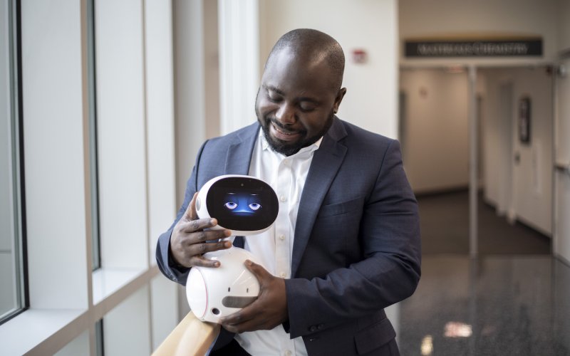 Benjamin Yankson with robot he is using in virtual workshops