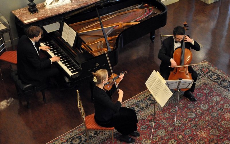 view from above of a pianist, violinist and cellist