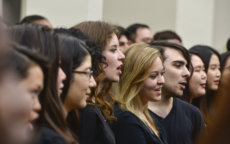 group of individuals in a line singing