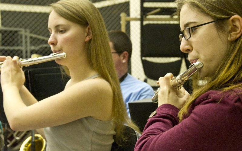 two musicians playing flutes
