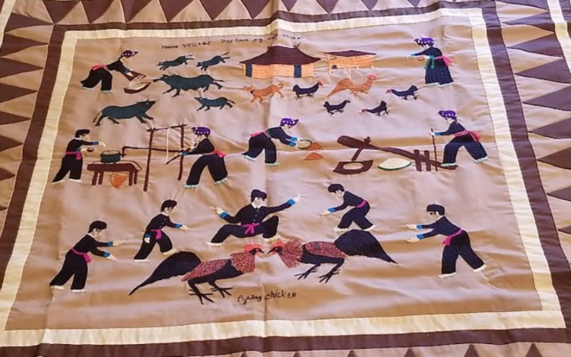 textile with human and animal figures