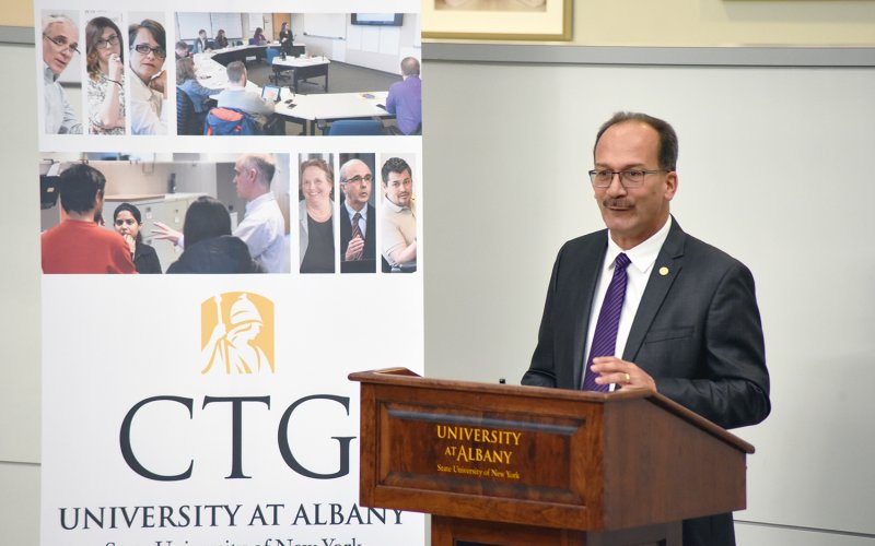 President Havidán Rodríguez speaks at a lecturn during the 25th anniversary of the Center for Technology in Government.