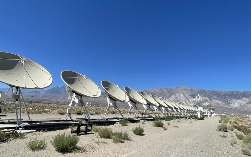 a row of radio astronomy telescopes at the Deep Synoptic Array at Owens Valley Radio Observatory.