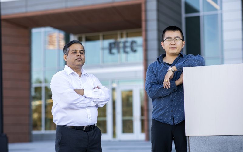 UAlbany researchers Md. Aynul Bari and Jie Zang stand outside of the ETEC building.