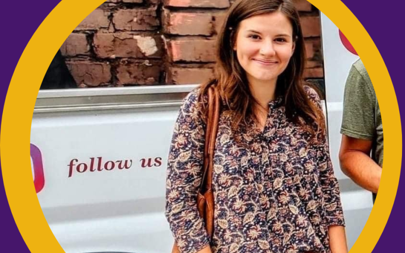 Sarah Ryan in front of St. Catherine's Van