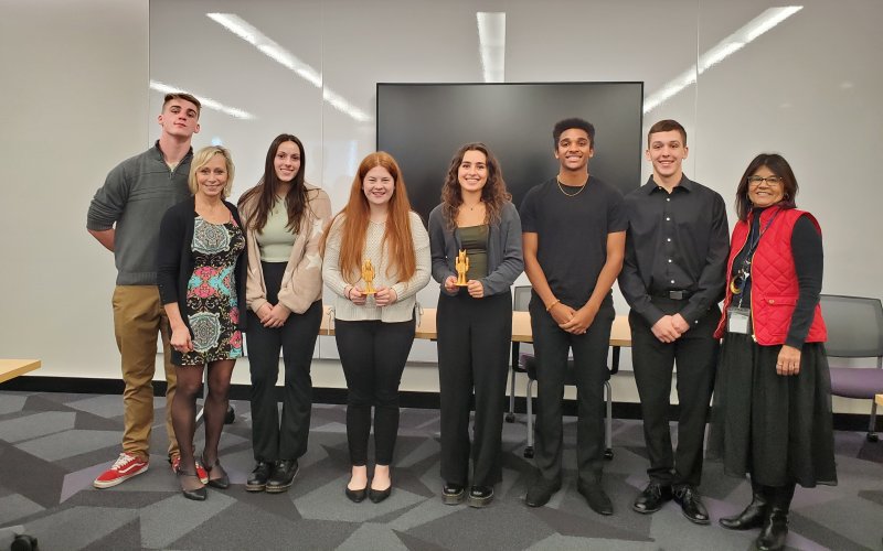 EPICH students and program leaders stand for a photo following the "Shark Tank" competition.