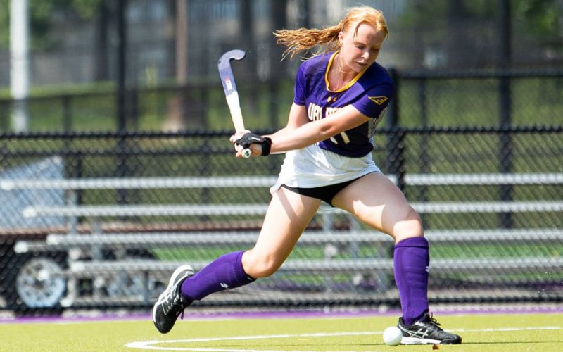 UAlbany field hockey player Alison Smisdom steps up to a strike a ball with her field hockey stick outside on the UAlbany turf field.