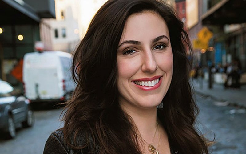 Jessica Valenti smiling while standing on a street