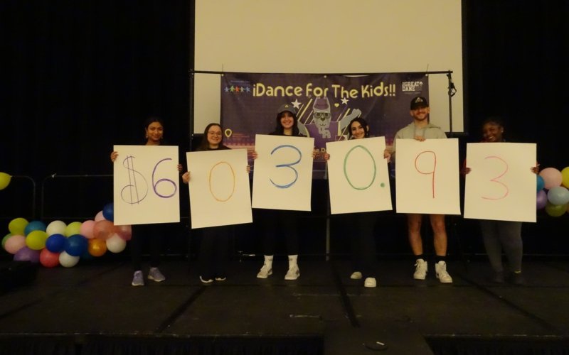 Students reveal fundraising amount at the UAlbany Great Dane Dance Marathon.