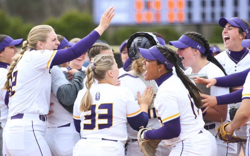 The UAlbany womens softball team celebrates a victory during the 2023 season.