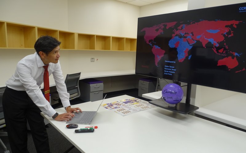 Ariel Pinto reviews a heat map displaying the global spread of malware attacks from the Cyber Risk Lab at ETEC.