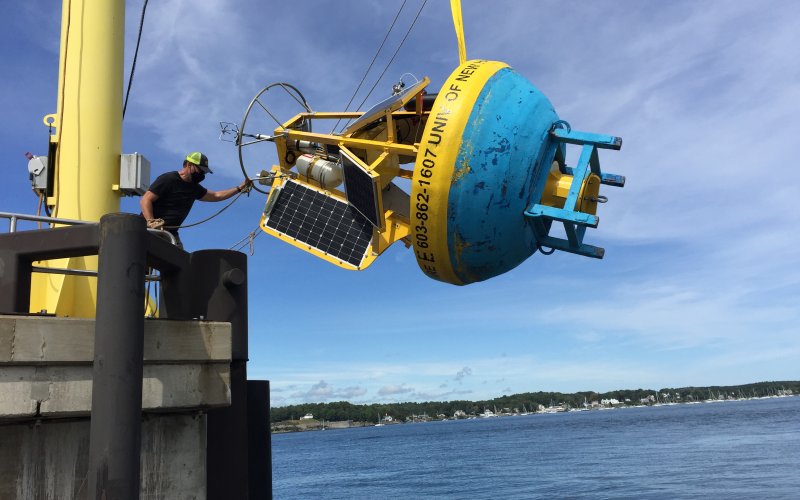 University of New Hampshire research scientist Shawn Shellito prepares a buoy for testing in the Gulf of Maine.