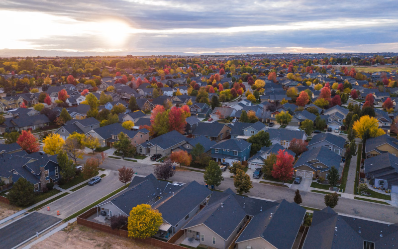 An aerial view of a larger neighborhood in autumn.