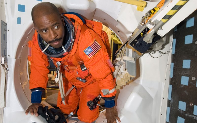 Former NASA Astronaut Leland Melvin trains inside a space station mockup at the Johnson Space Center in 2009.