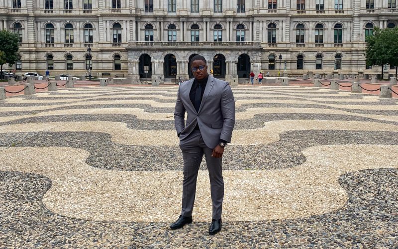 Graduate Ambassador Jeremy Baker poses infront of the Capital Building in Albany, New York.