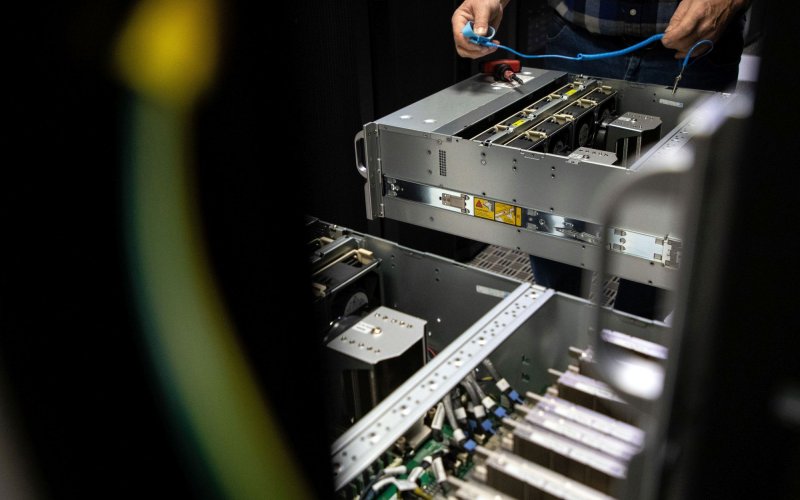 hands are seen installing computer units