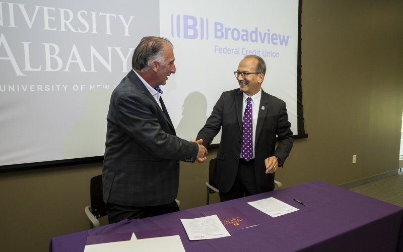 UAlbany President Havidán Rodríguez (r) and Broadview CEO Michael J. Castellana (l) sign agreement offering a set of three certificate programs beginning this fall