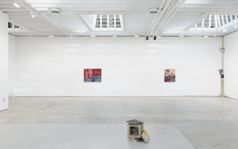 Mosie Romney's work hangs in a spacious, well-lit gallery.