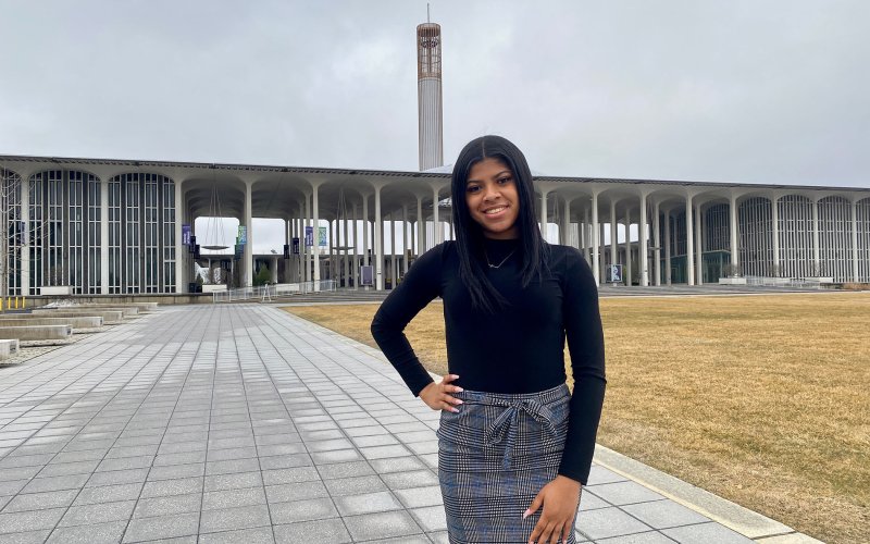 Photo of Ariana Barrett on the Entry Plaza of the Uptown Campus.