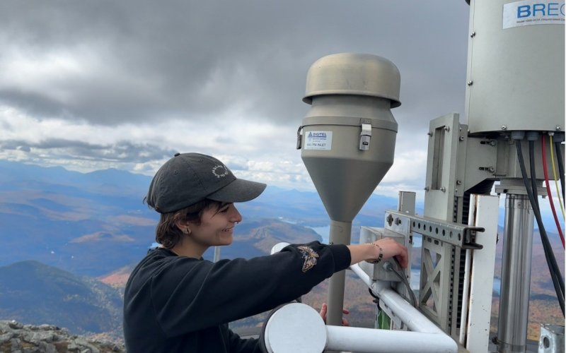 Sara Lombardo configures cloud water instrumentation from the top of Whiteface Mountain.