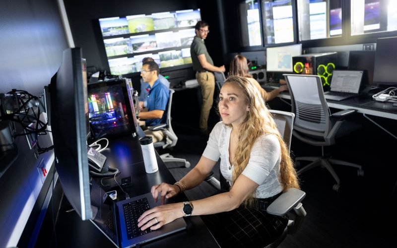 Meteorologist Kara Sulia focuses on a computer screen.