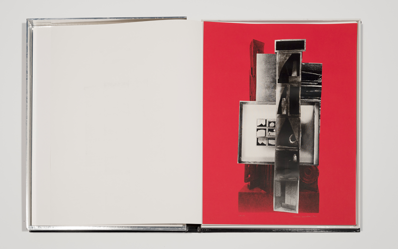 An open notebook with abstract, photo-like imagery on one page.