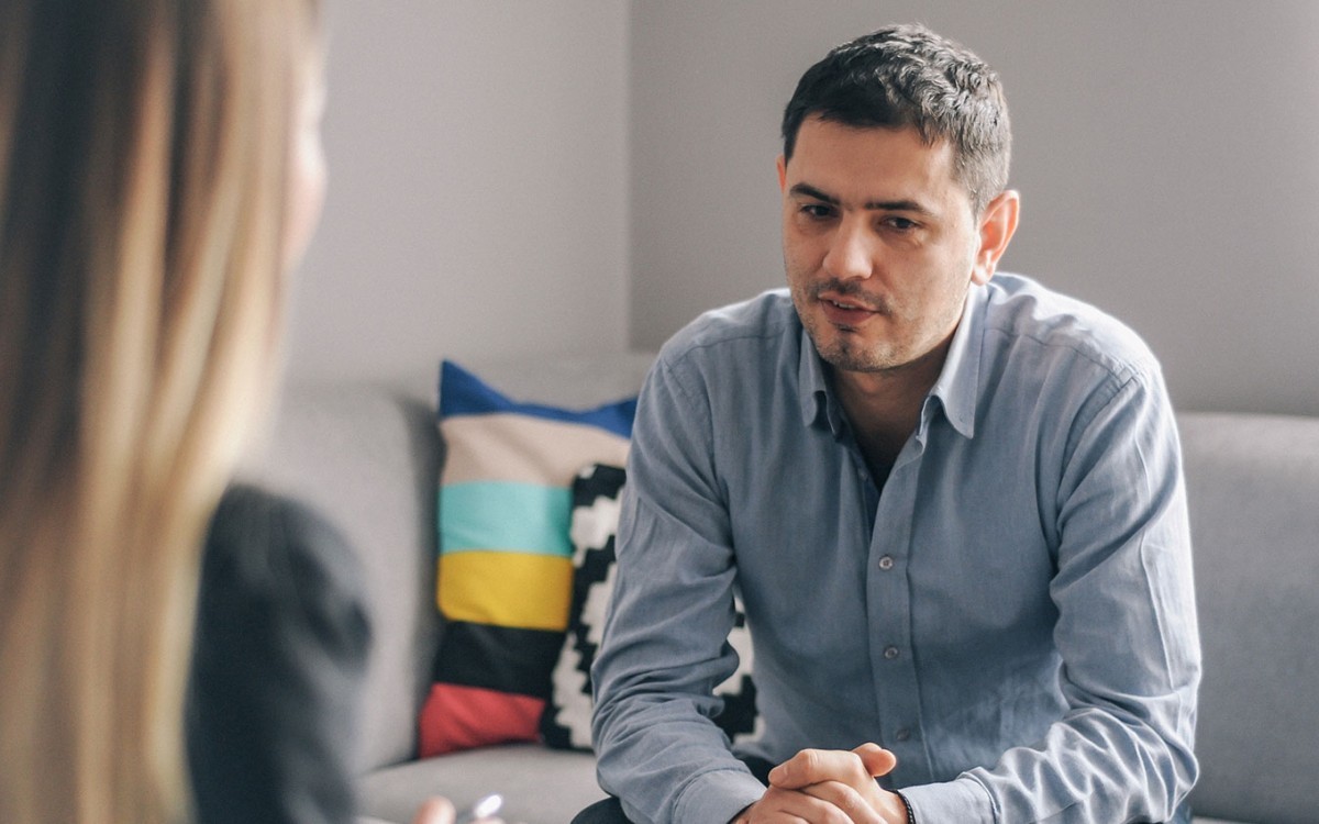 A substance abuse counselor meets with a client in her office.