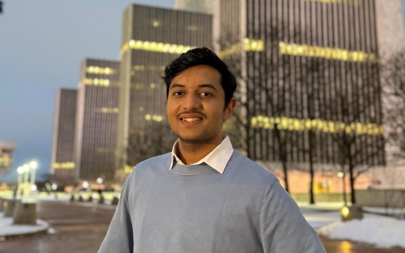 UUlbany graduate student Pallav Savaliya stands in front of the Empire State Plaza.