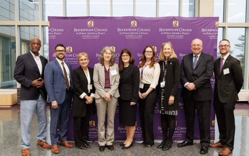 Award winners and college dean Julie Novkov at the 2025 awards ceremony. 
