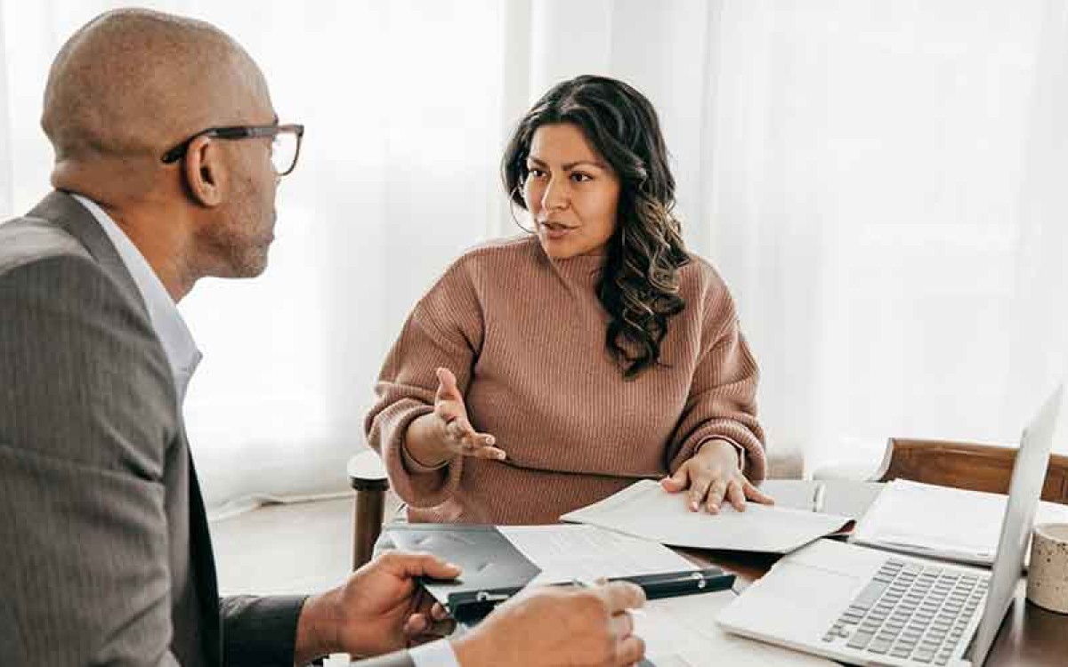 A human resources manager interviews a candidate for a position.