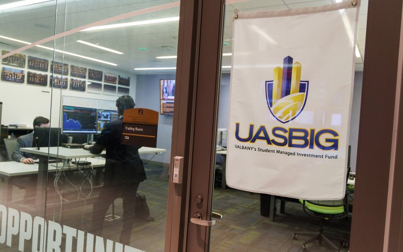 A sign outside of the Bloomberg room at UAlbany's Massry School of Business reads UASBIG for the student investment group.