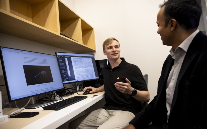 Stephen Gravereaux meets with his mentor Sheikh Islam at the Cognitive-Security, Accountability, Fairness and Explainability (CAFE) Lab,