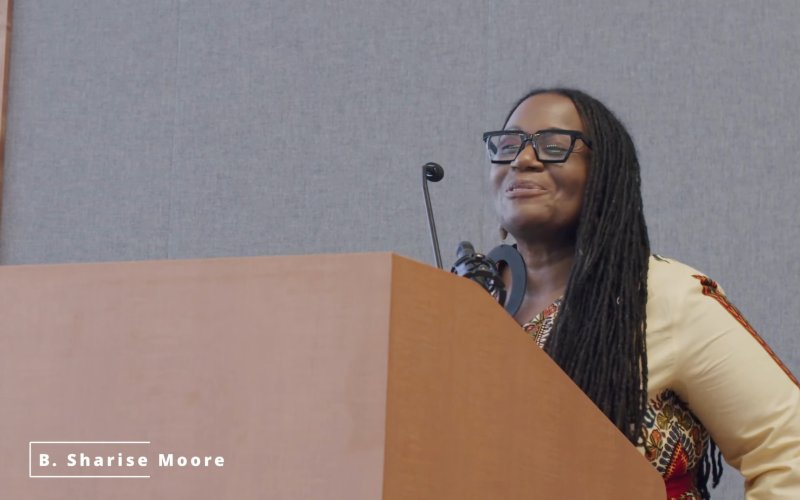 Keynote speaker B. Sharise Moore addresses the attendees at the lectern.