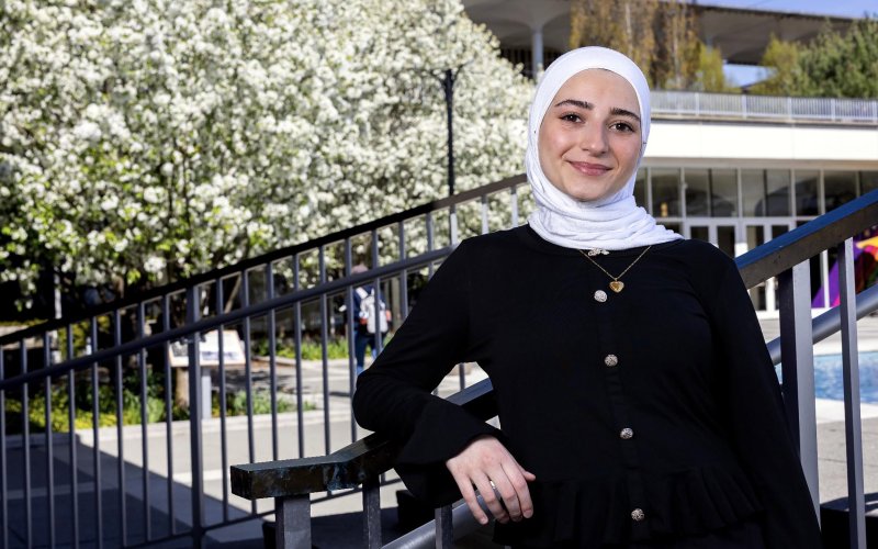 A potrait of UAlbany student Massa Masri near the main fountain on the uptown campus podium