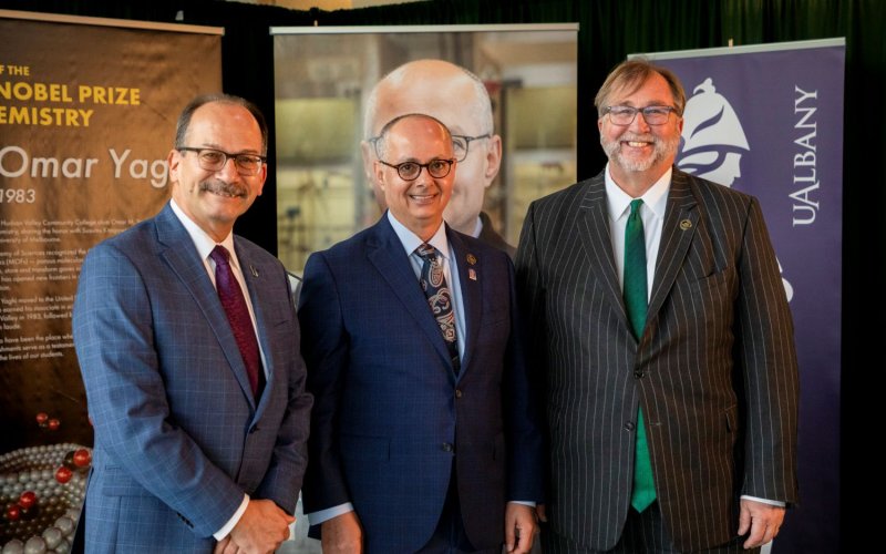Omar Yaghi stands with UAlbany President Havidán Rodríguez and Hudson Valley President Michael Brophy 