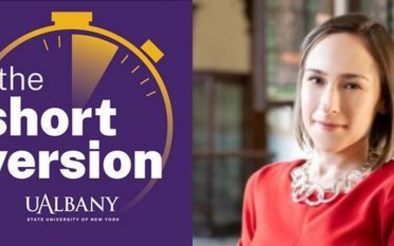 Logo og a stopwatch with the words "The Short Version UAlbany" next to a photo of a woman in a red dress.
