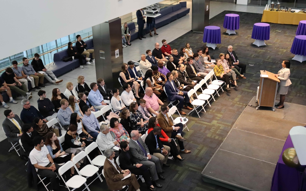 Dean Paquita Davis-Friday speaks to an audience of students and loved ones during the third annual Graduating Student Achievement Awards.