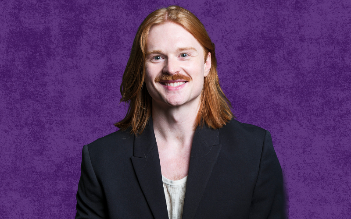 Headshot of Blaine Horton on a purple background