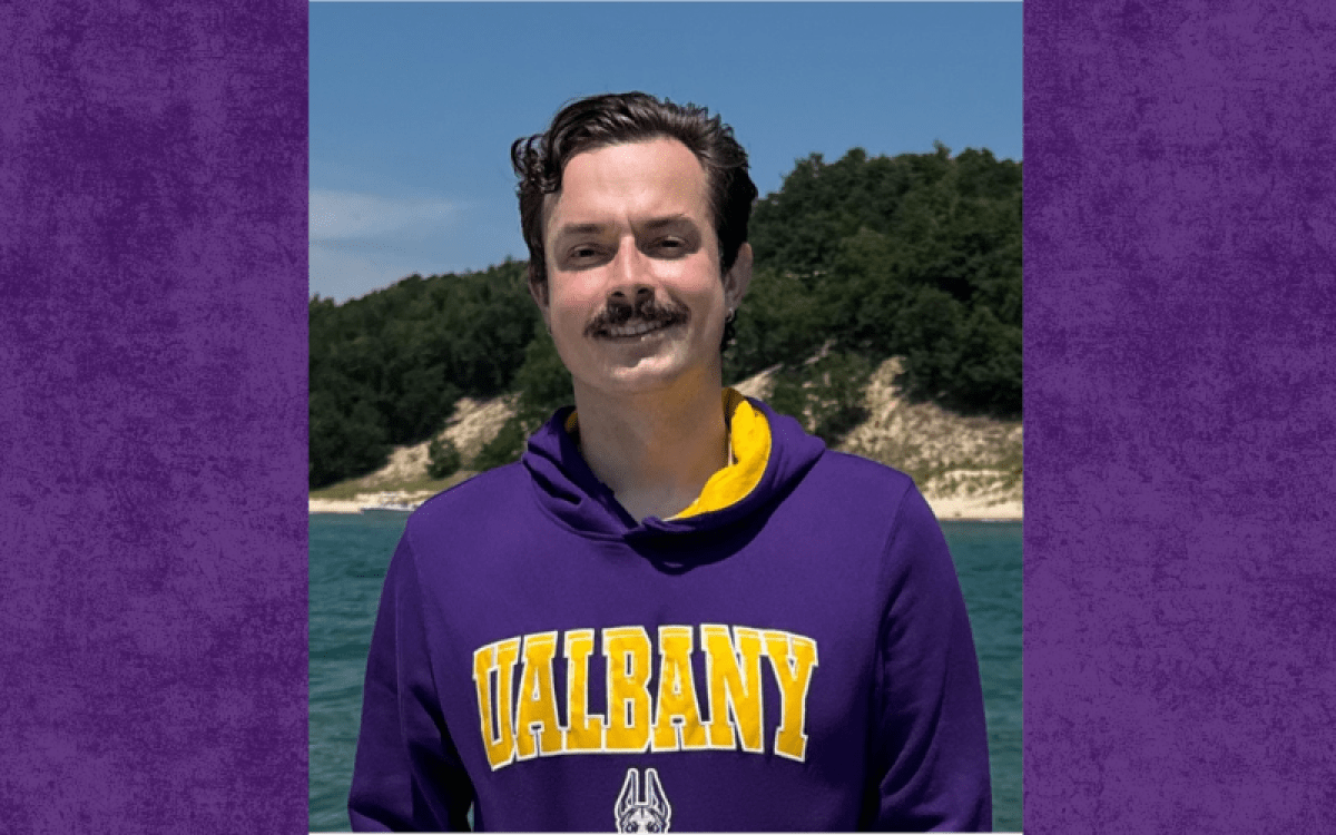 Headshot of Schirmann in a UA sweatshirt