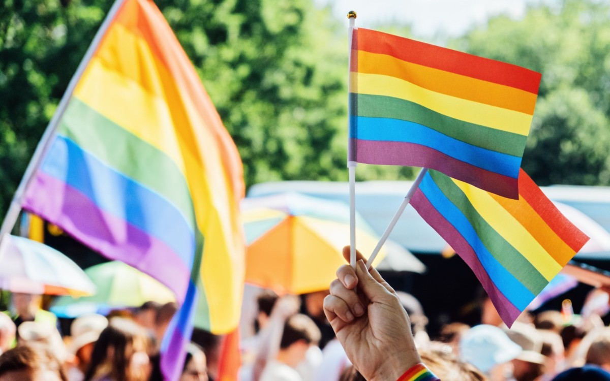 Pride flags at a gathering.