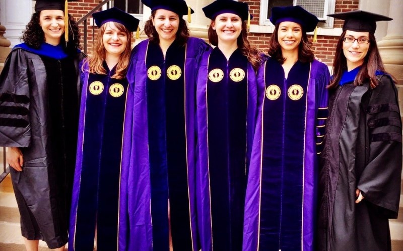 Last year's Department of Atmospheric and Environmental Sciences female PhD graduating class with professors Kristen Corbosiero and Andrea Lang.