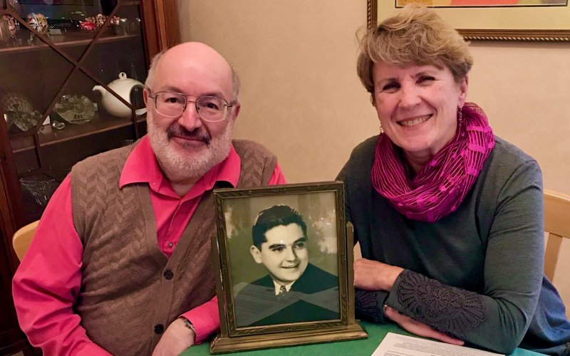 Robert & Diana Bangert-Drowns with a photo of Bob's uncle, Fr. Martin