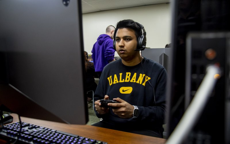 Student plays FIFA in the UAlbany eSports Arena.