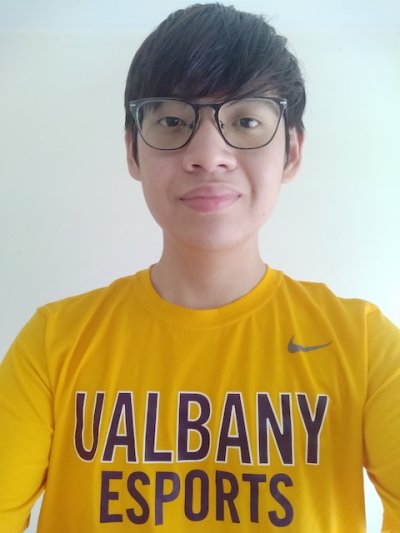 Andy Xu poses with UAlbany eSports t-shirt