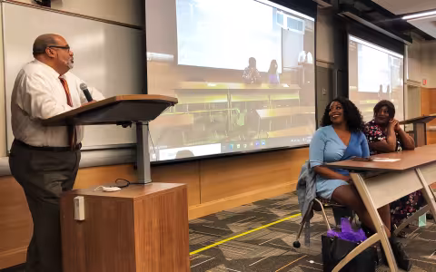Miller, Wooley, and Williams speaking in class